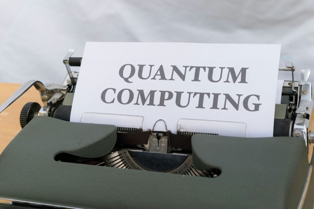 An old-fashioned typewriter with a piece of paper that says "QUANTUM COMPUTING" typed on it. This image highlights the need to address Quantum Threats through advancements in Post-Quantum Cryptography to secure future digital communications.